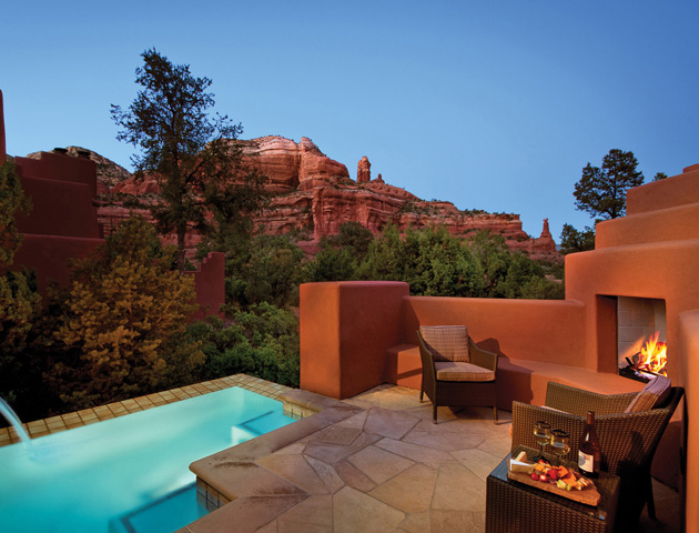 private pool with fireplace at dusk