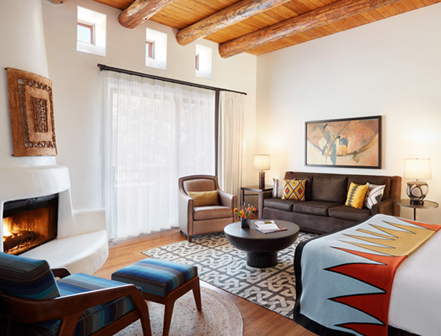 Guest room with fireplace, couch and murphy bed