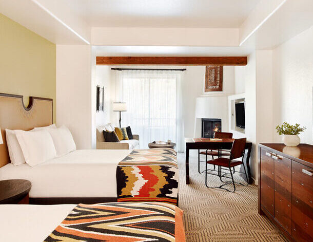 Junior Suite Room with 2 beds, fireplace, desk, couch and dresser