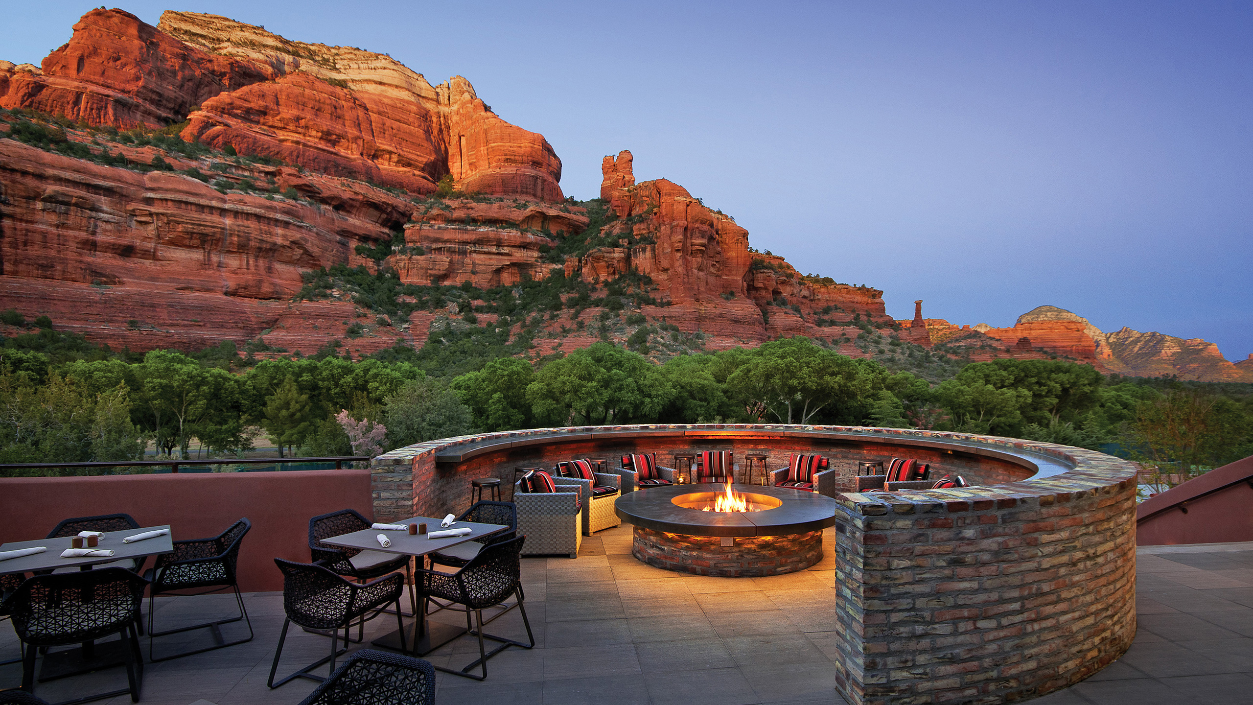 restaurant fire pit with chair and red rock views