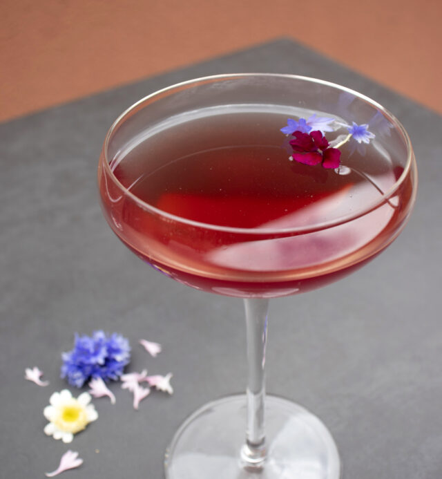 red cocktail with flowers
