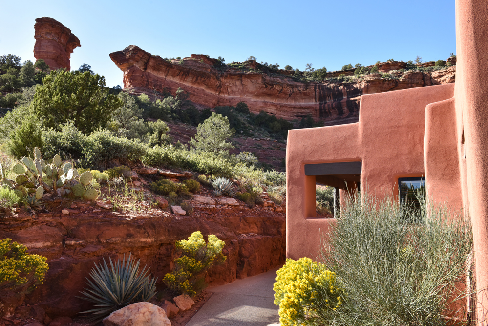 casita with yellow flowers and red rocks