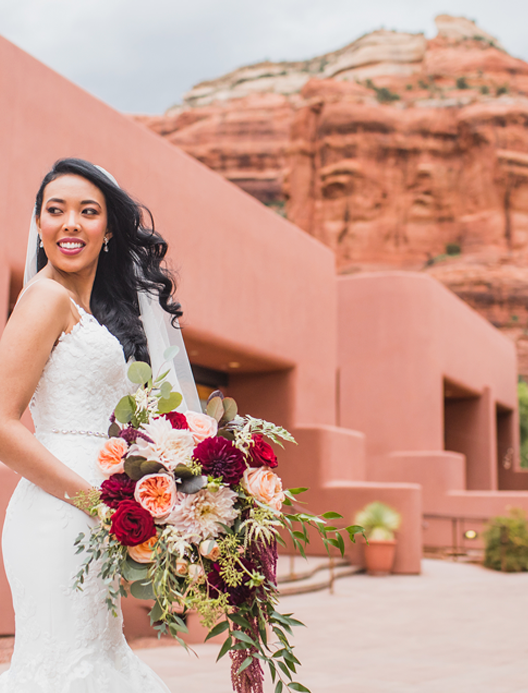 Sedona Bride Photographers - image of bride at Enchantment with flowers