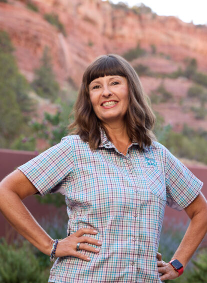 female hiking guide in blue shirt