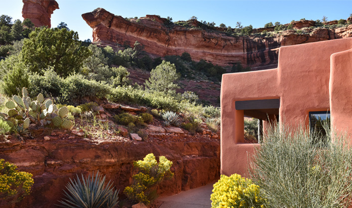 Casita guest room exterior with yellow flowers