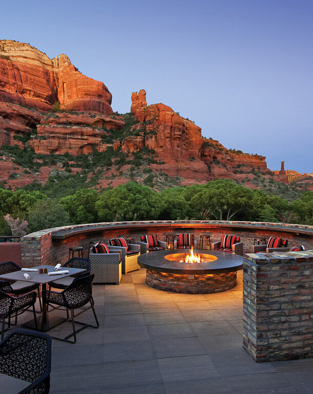 restaurant fire pit with chair and red rock views