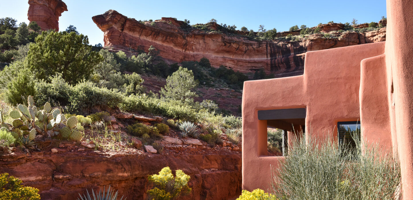 casita with yellow flowers and red rocks