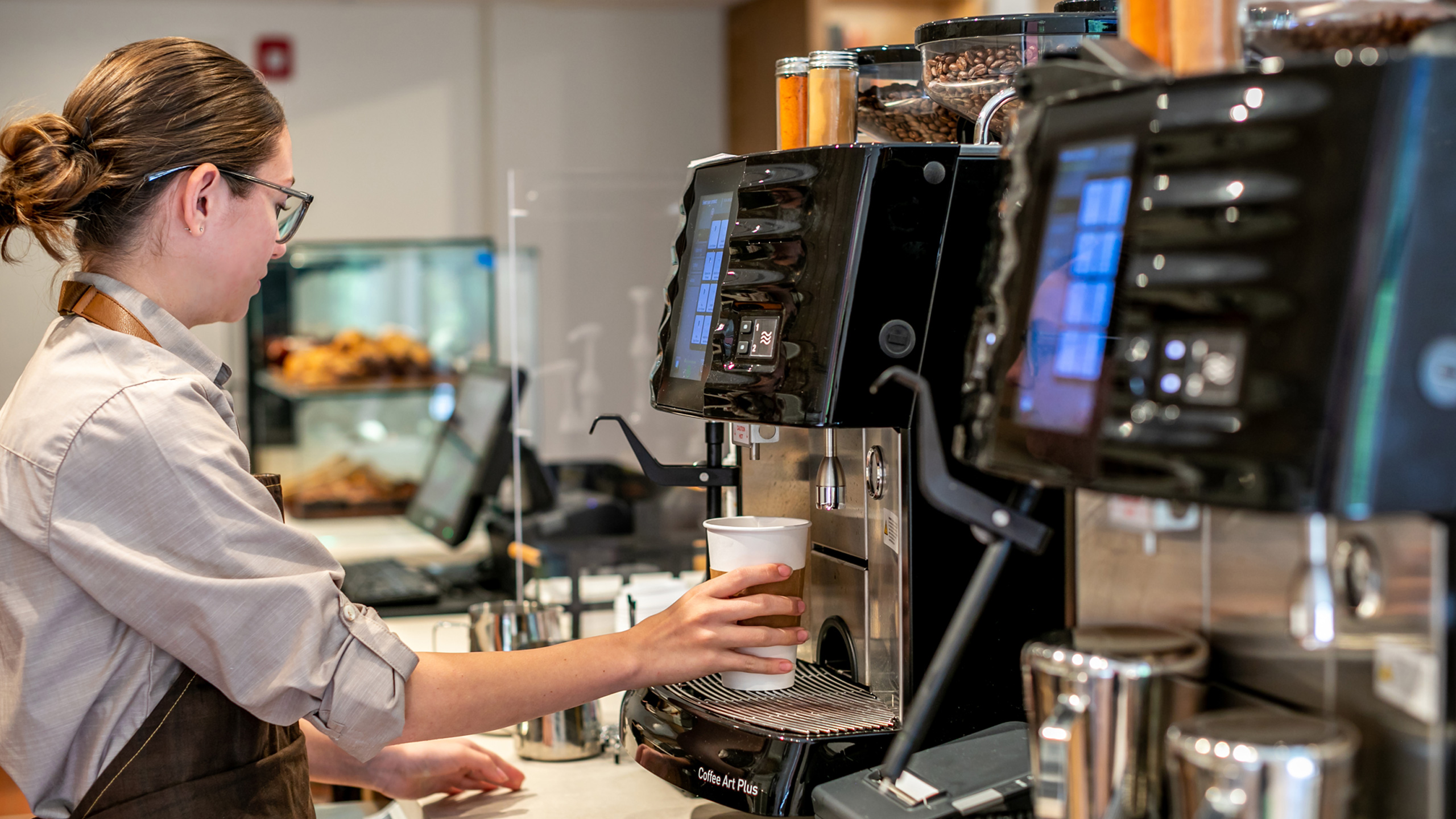 barista pouring coffee