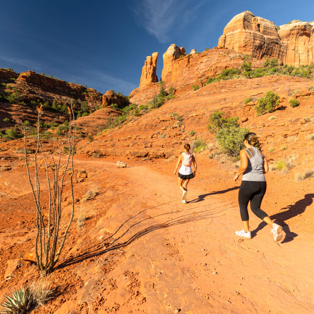 two women runners on trail