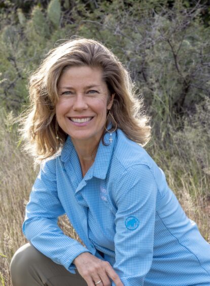 blonde haired woman in blue collared shirt