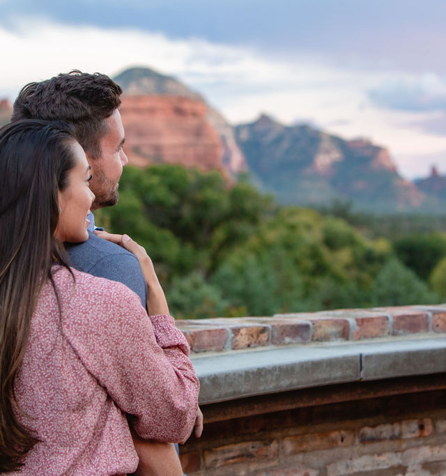 couple looking out to view of Sedona's red rock formations at Enchantment Resort