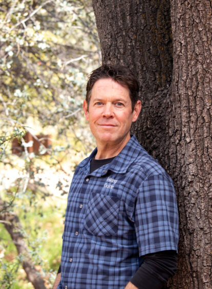 hiking guide in blue collared shirt