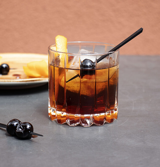 old fashioned cocktail with cherries