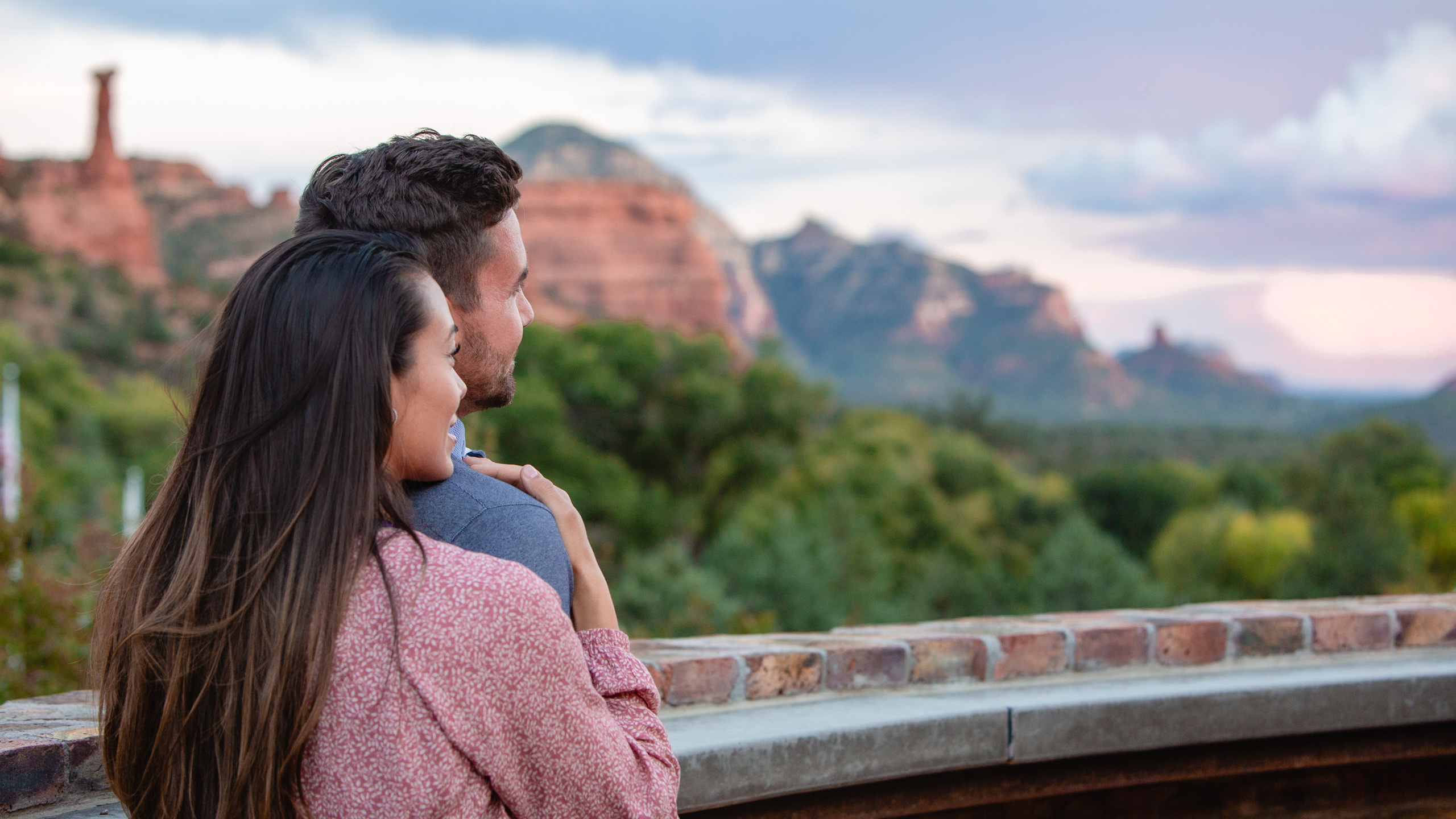 couple looking out to view of Sedona's red rock formations at Enchantment Resort