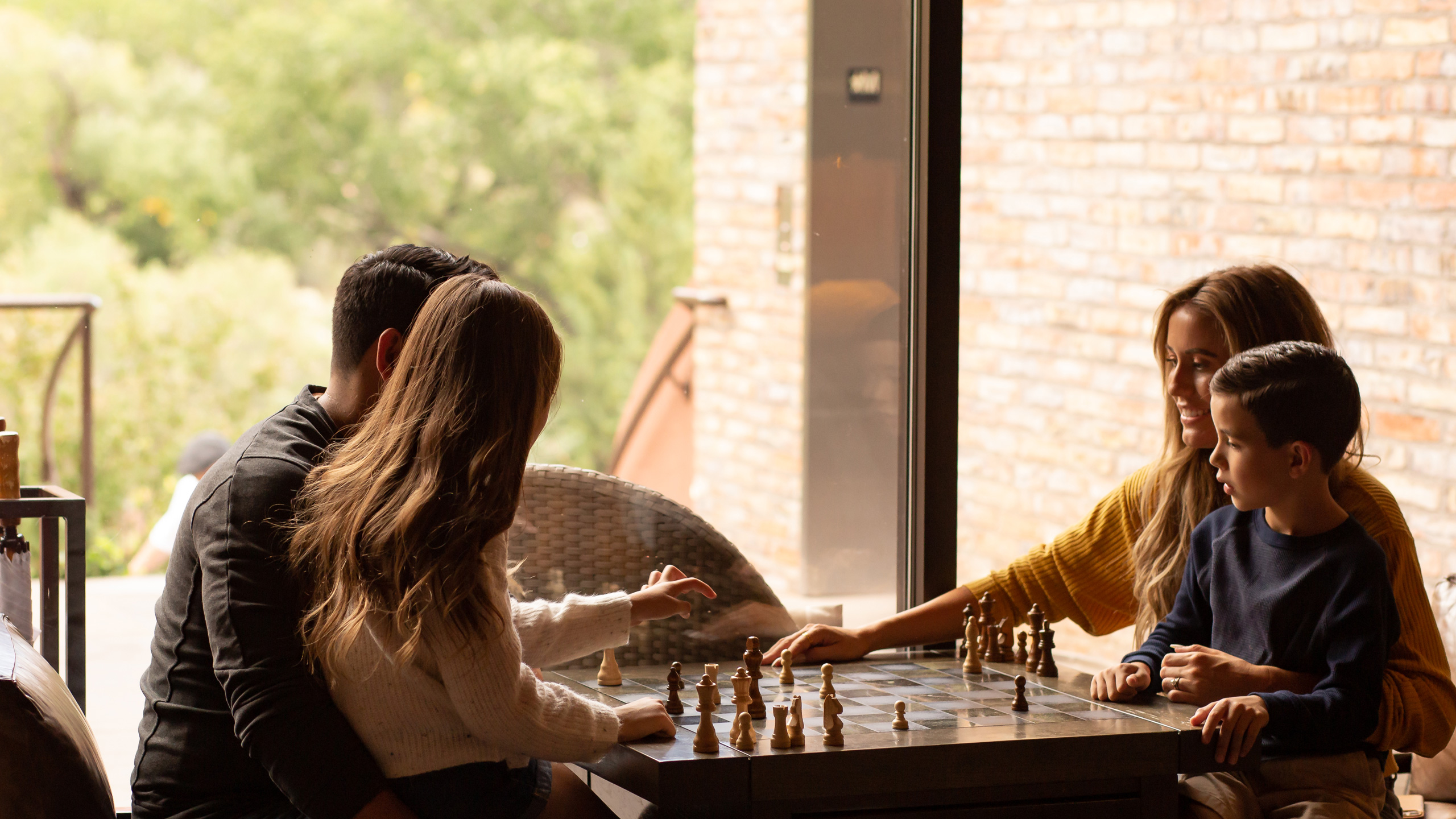 family playing chess