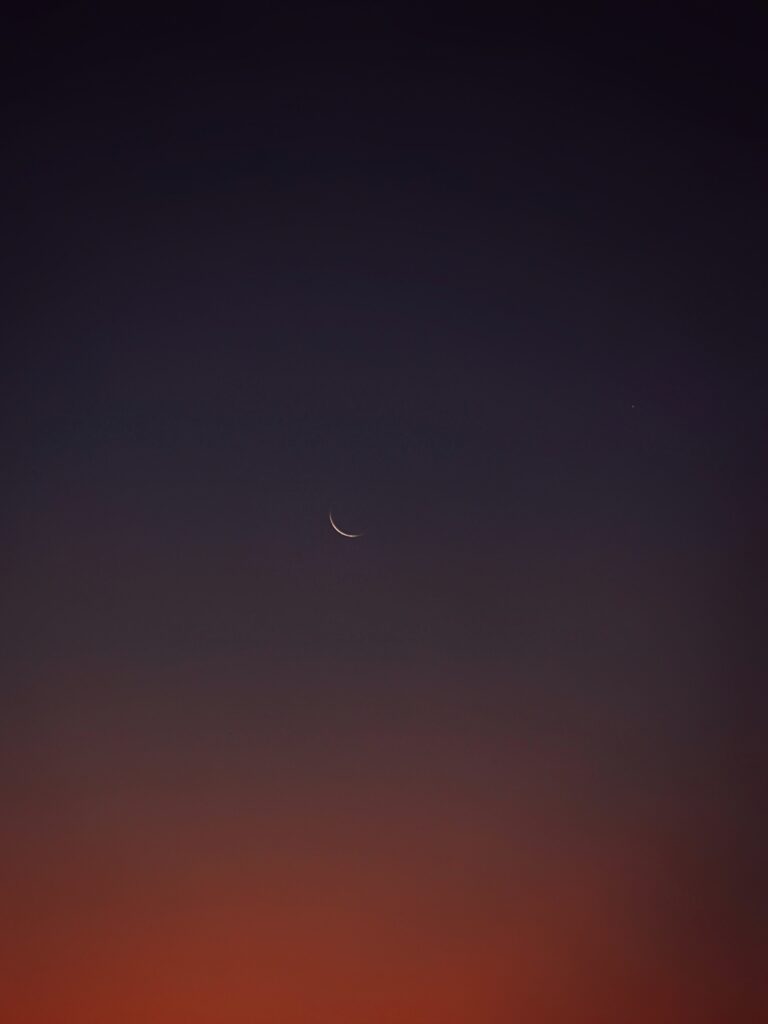 sky with sliver of moon