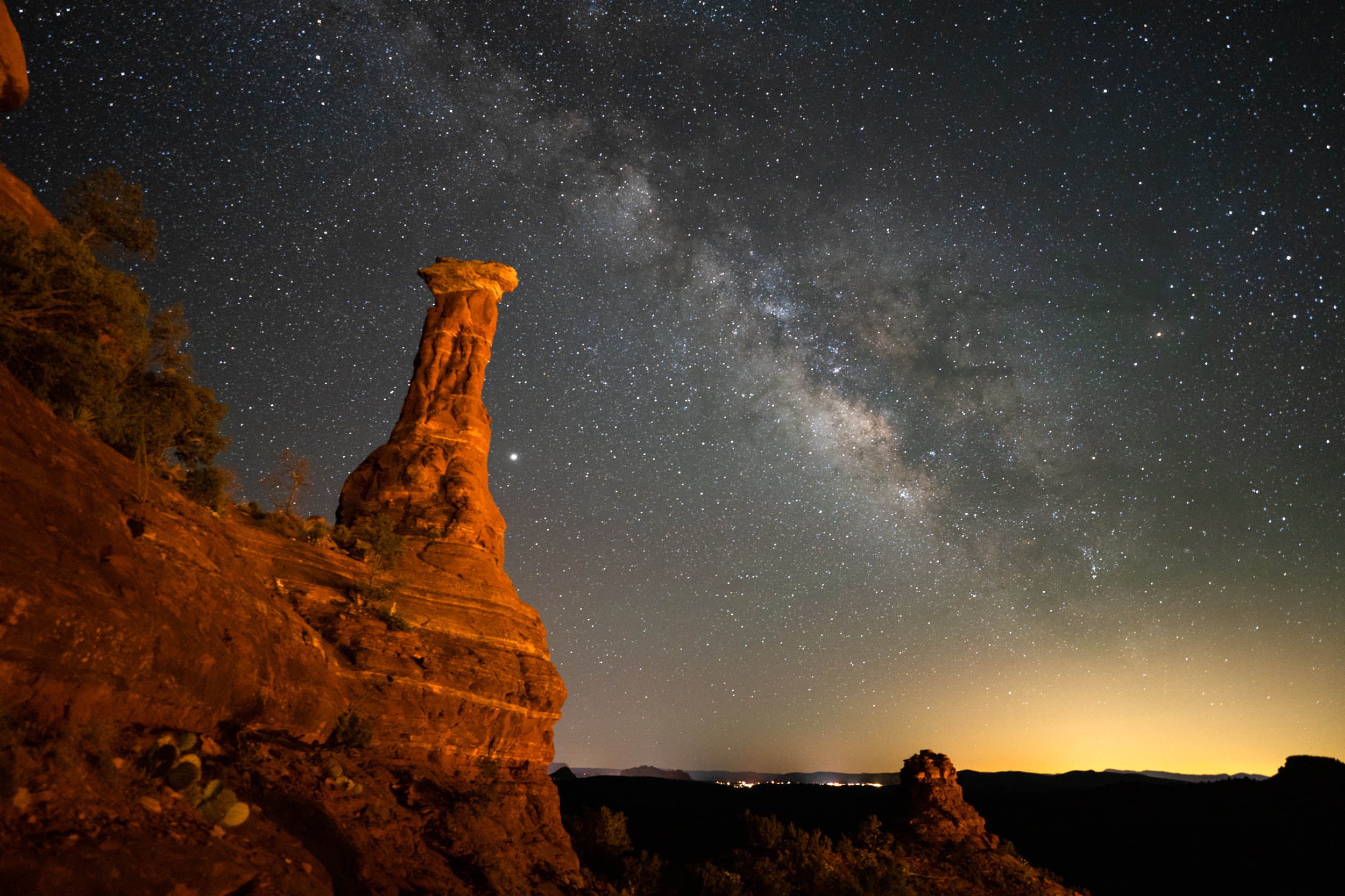 night sky photo of red rock cliffs