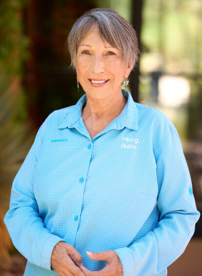female hiking guide in blue shirt