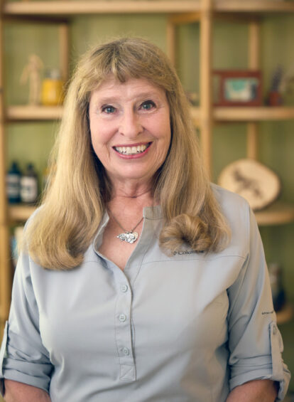 female artist with blond hair and light blue shirt